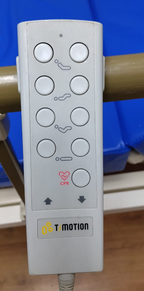Control de mano TiMOTION original de la cama, con marcas de uso.